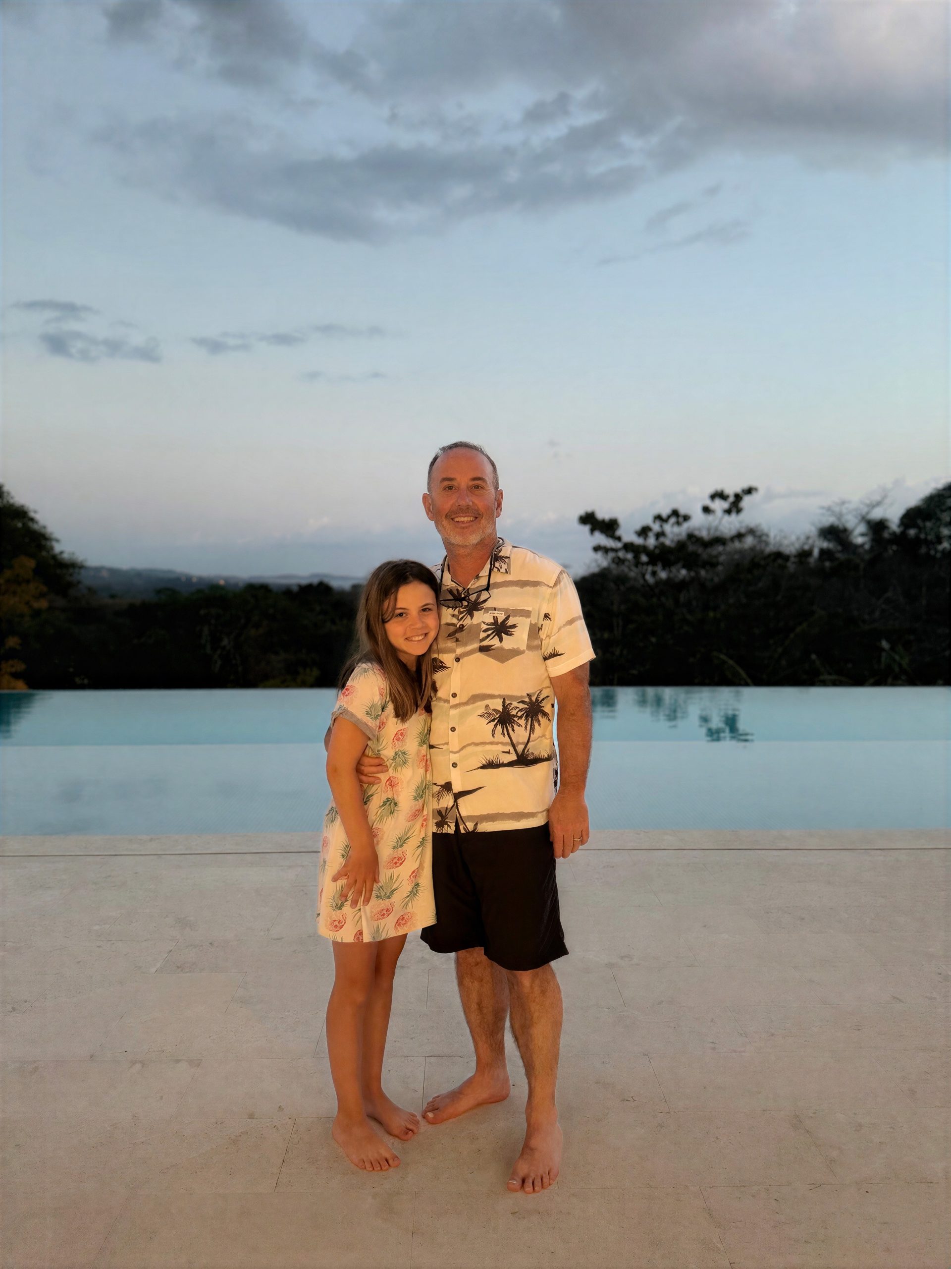 Little girl on the beach with her dad